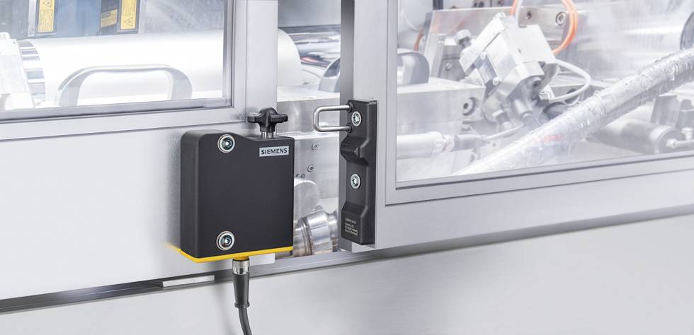 Serrure de sécurité électrique de Siemens sur une machine industrielle. Protège contre l'accès non autorisé et améliore la sécurité.