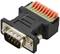 'Adaptateur DB9 noir avec barrette de bornes verte et rouge, utilisé pour les connexions série dans les appareils électroniques.'
