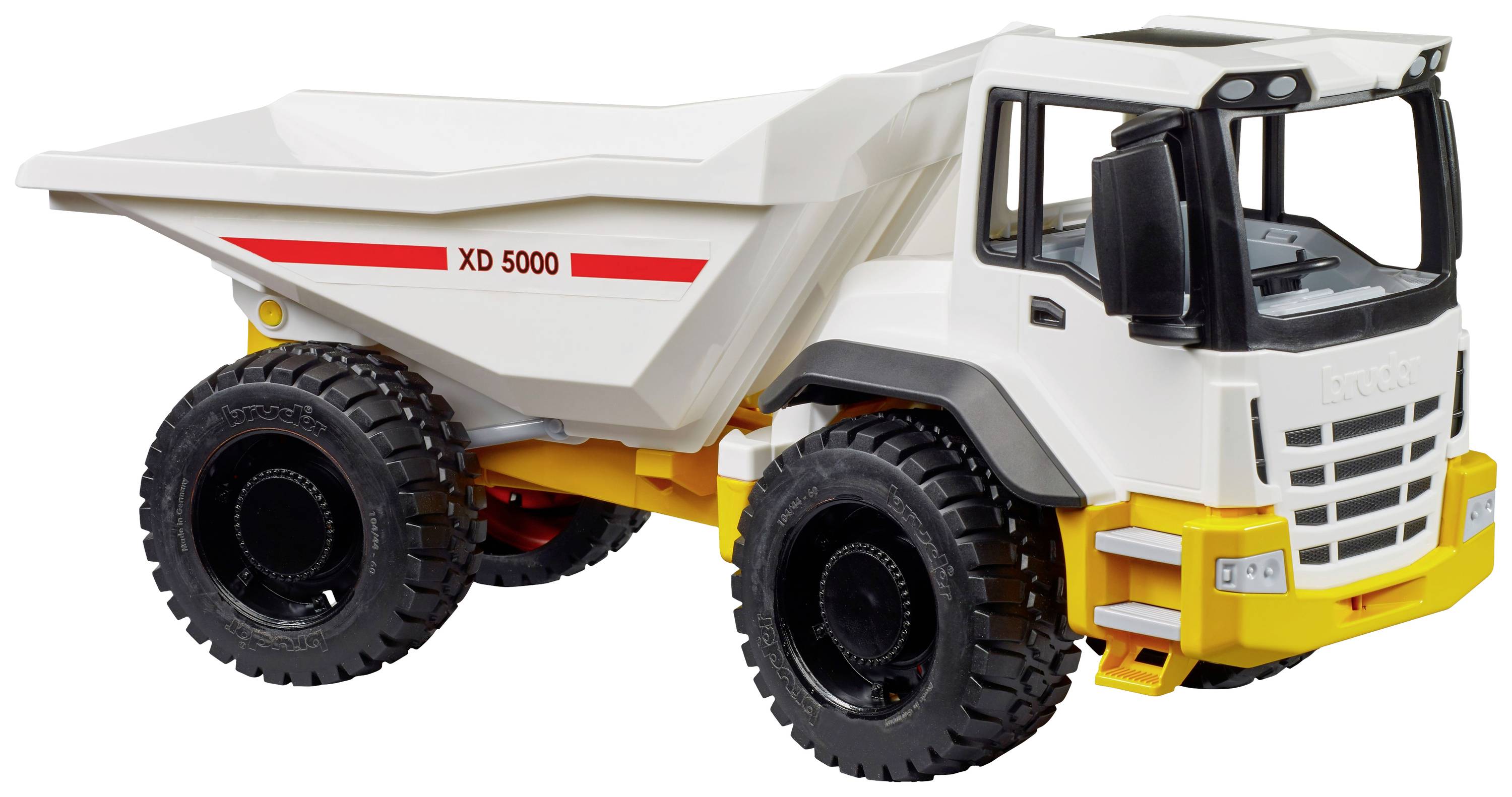 Modèle miniature d'un camion blanc portant l'inscription 'XD 5000' sur sa benne, avec de grandes roues noires et des touches de couleur jaune.