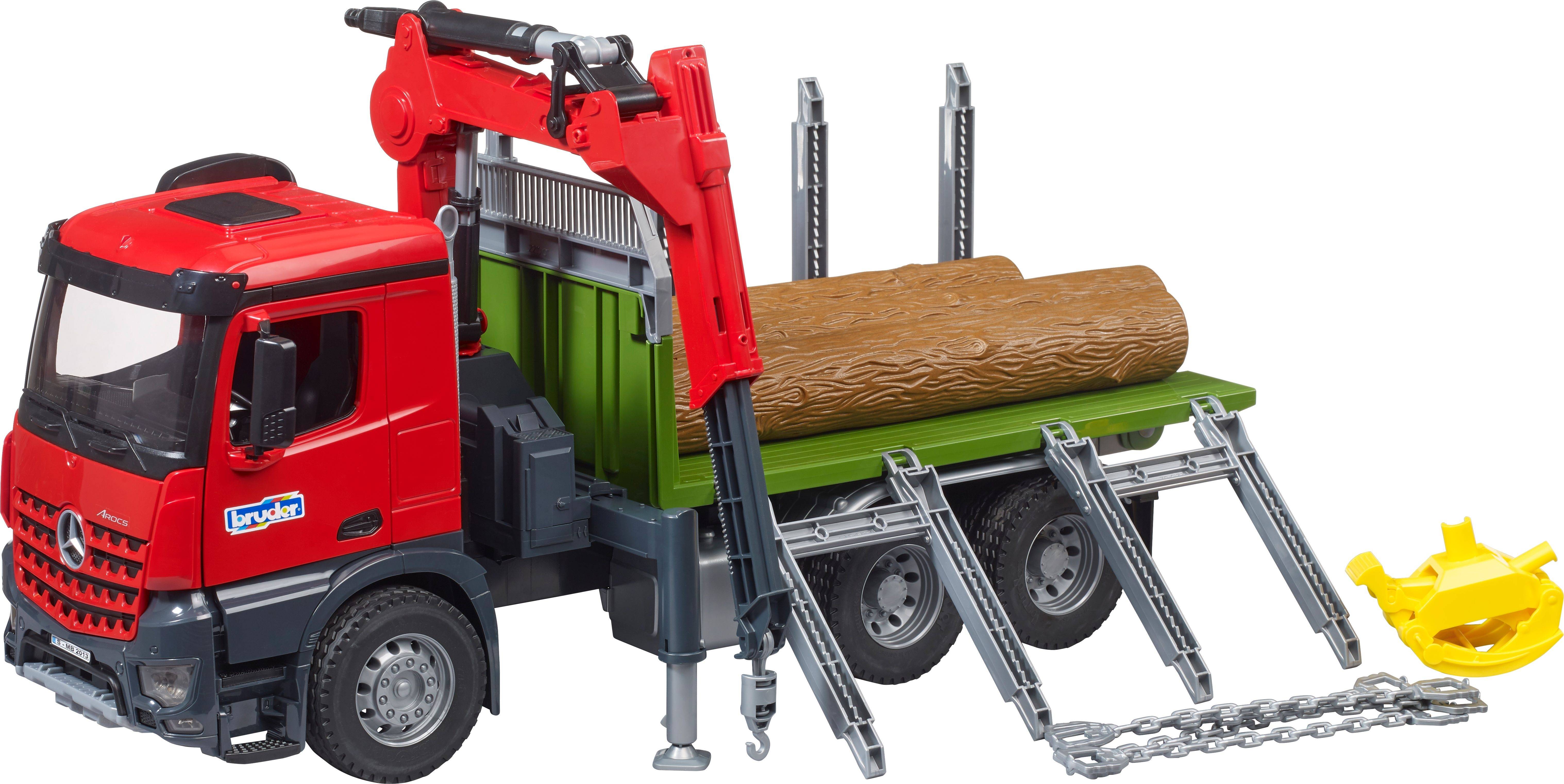 Un camion-jouet rouge transportant des grumes de bois sur sa plateforme, équipé d'une grue pour le chargement et le déchargement.