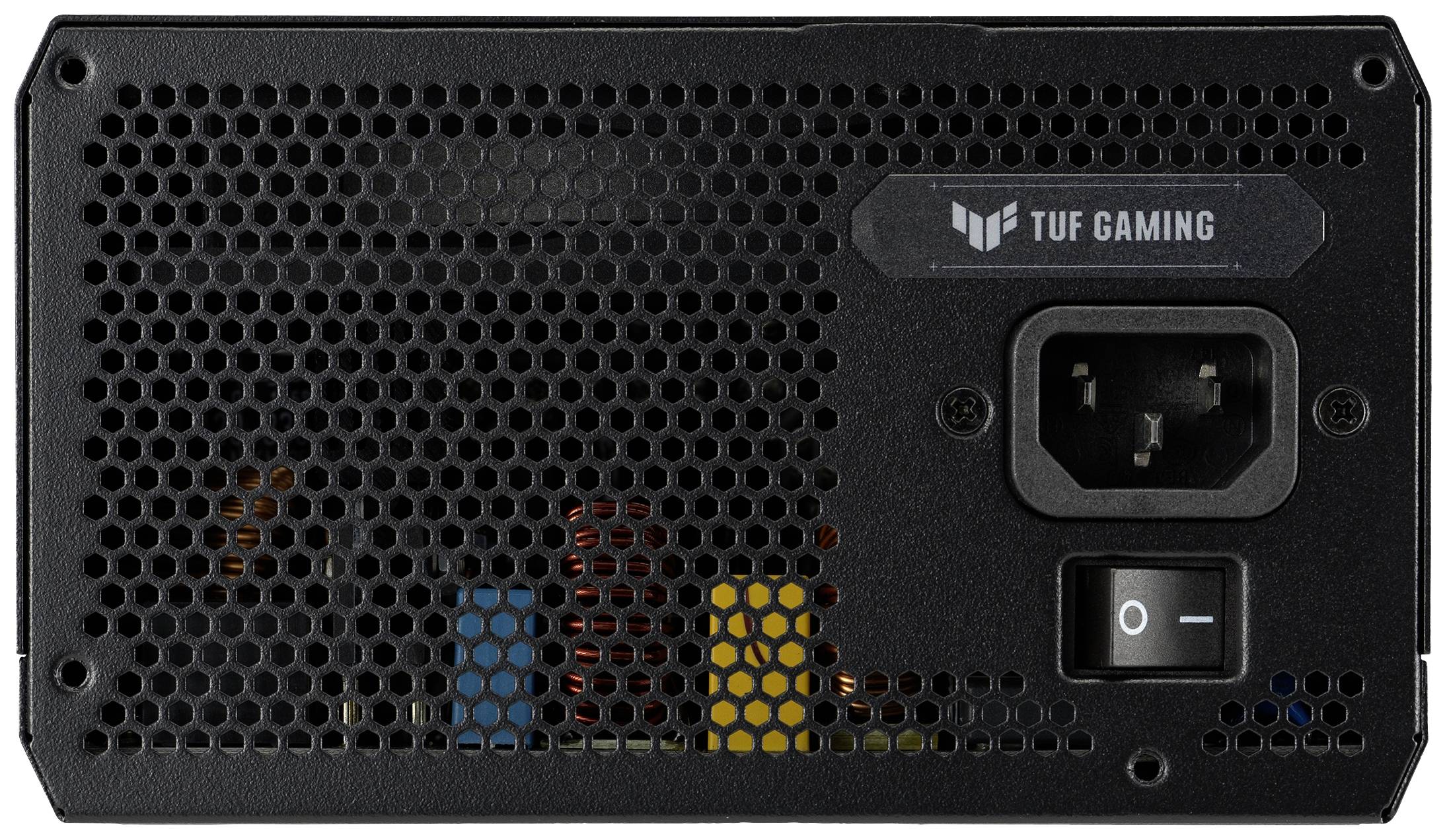 Bloc d'alimentation d'ordinateur noir avec grille de ventilation à gauche, interrupteur d'alimentation et connexion électrique à droite. En haut est inscrit 'TUF Gaming'.