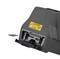 Un appareil noir avec une étiquette d'avertissement jaune. Il dispose d'emplacements pour USB-C et carte mémoire, partiellement sorti d'un compartiment.