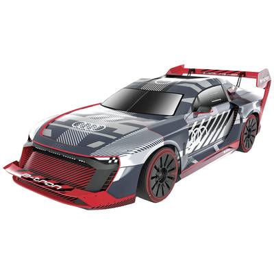 Un modèle de voiture de sport futuriste au design aérodynamique, à la couleur gris foncé et rouge, avec des bandes de course marquantes.