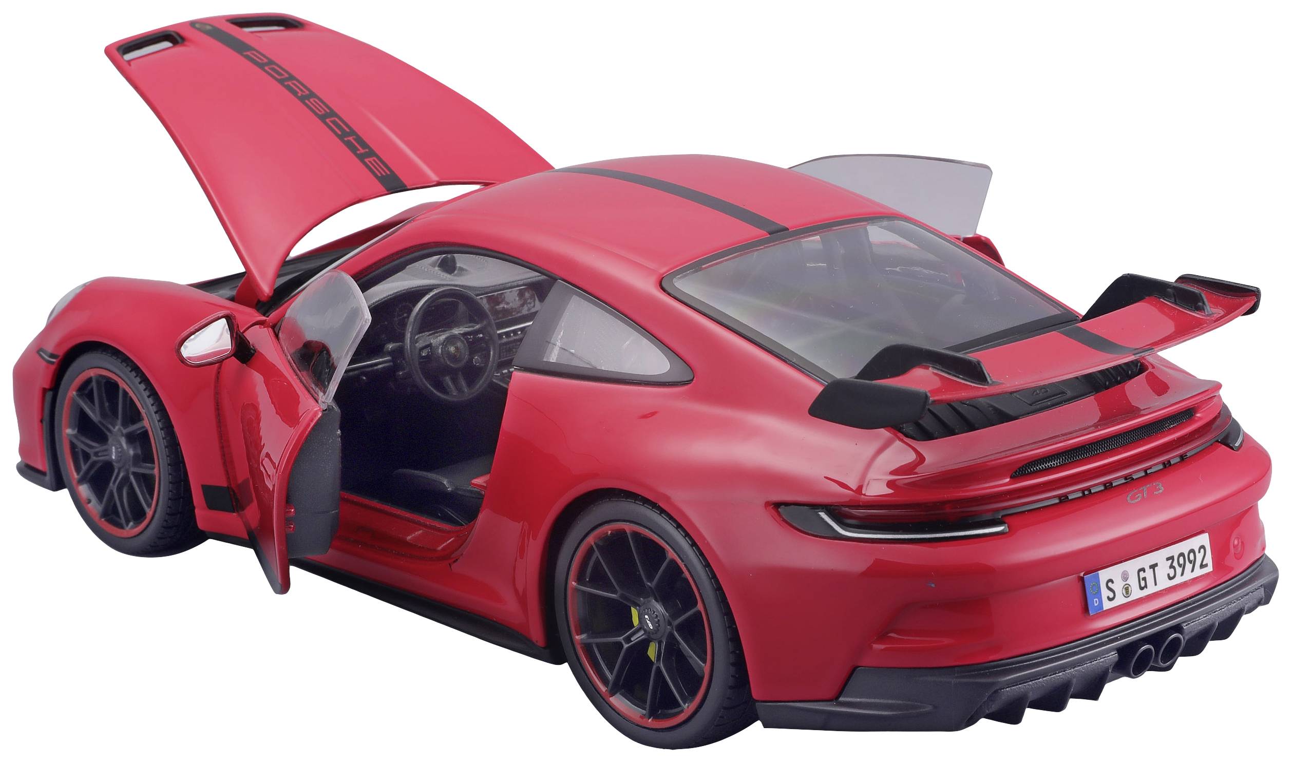 Un modèle de voiture de sport rouge avec les portes et le capot ouverts, l'intérieur visible.