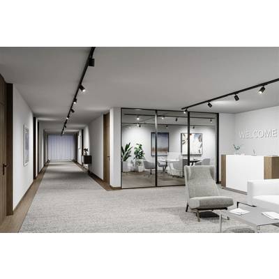 Bureau moderne et lumineux avec cloison de verre, salle de réunion et espace d'accueil. À droite, un panneau indiquant 'WELCOME' est installé.