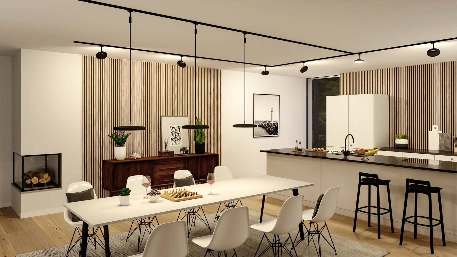 Cuisine moderne avec espace repas. Table à manger blanche avec chaises, suspensions élégantes, îlot de cuisine avec tabourets de bar et cheminée décorative.