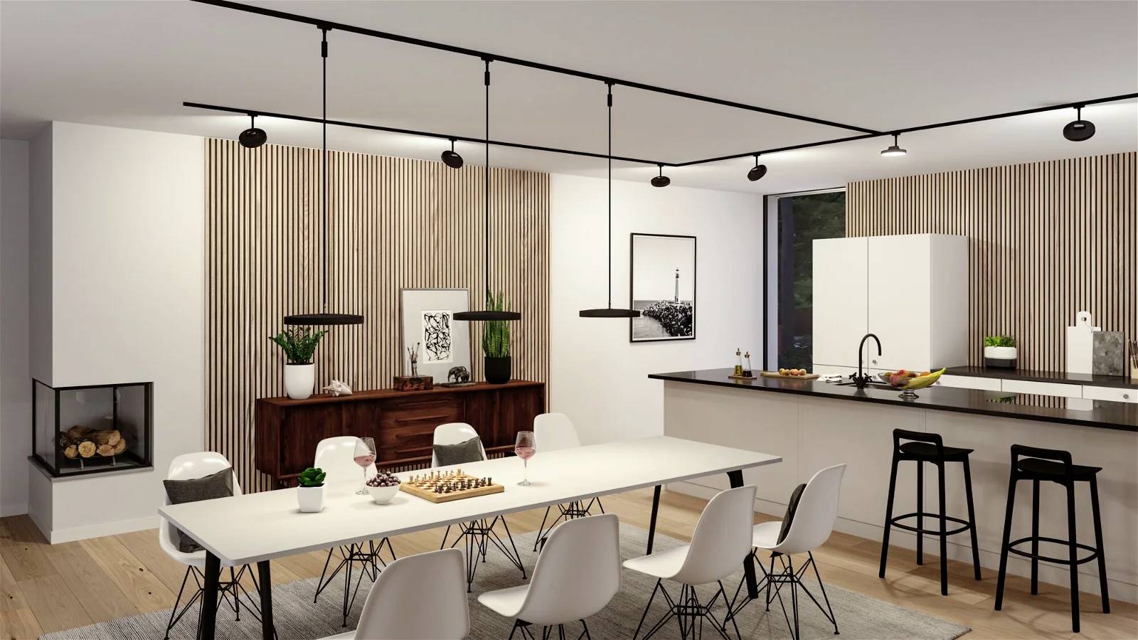 Salle à manger moderne avec une longue table, des chaises blanches et des suspensions élégantes. À l'arrière-plan, une cuisine ouverte avec des tabourets de bar.