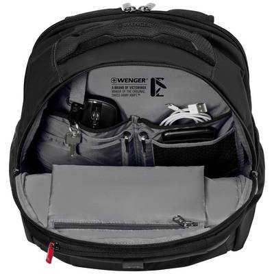 Un sac à dos noir ouvert montre plusieurs compartiments dans lesquels des appareils électroniques comme un chargeur et un câble sont soigneusement rangés.