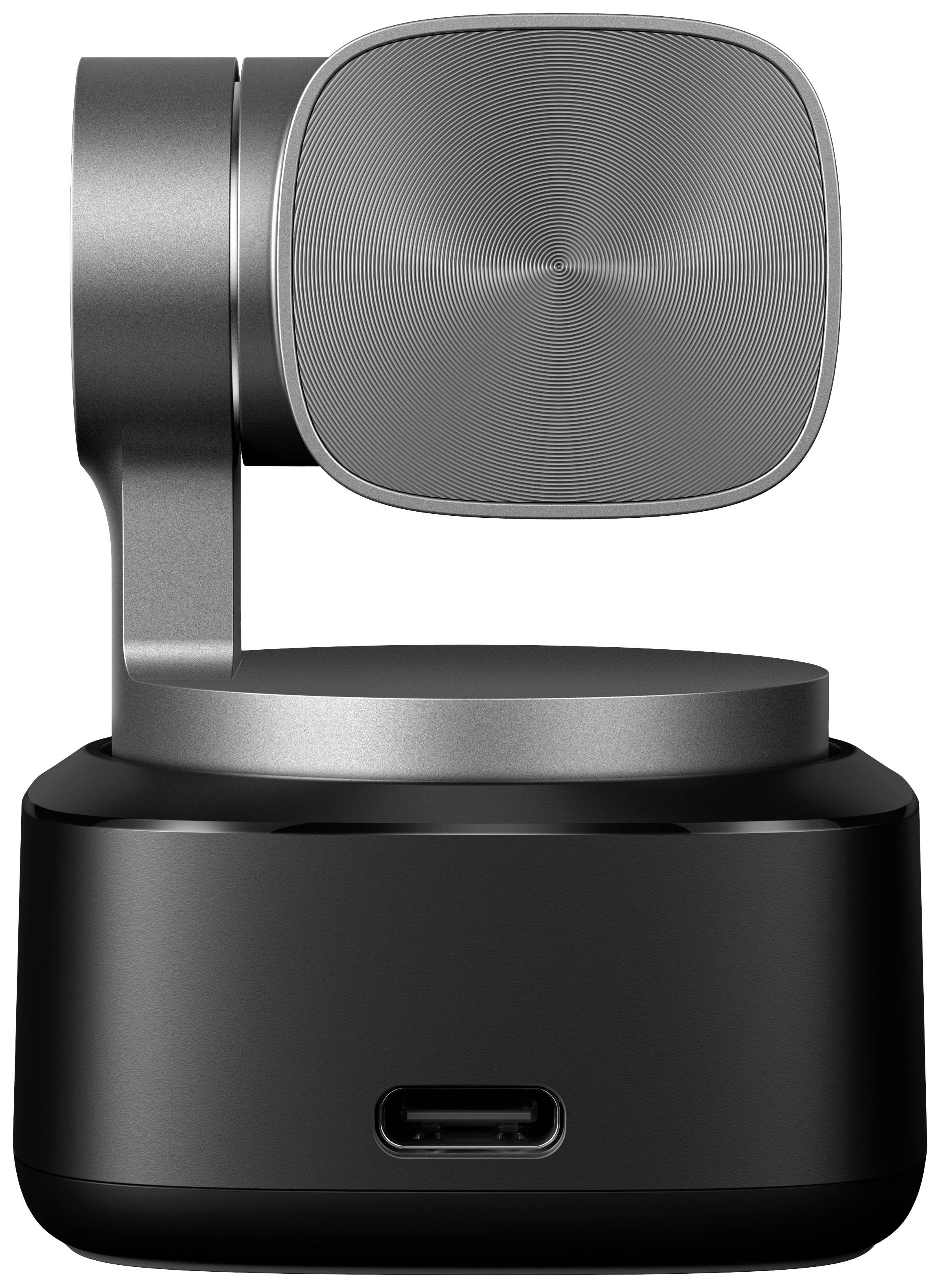 Un microphone gris moderne avec une tête pivotante et un port USB-C est posé sur un socle noir.