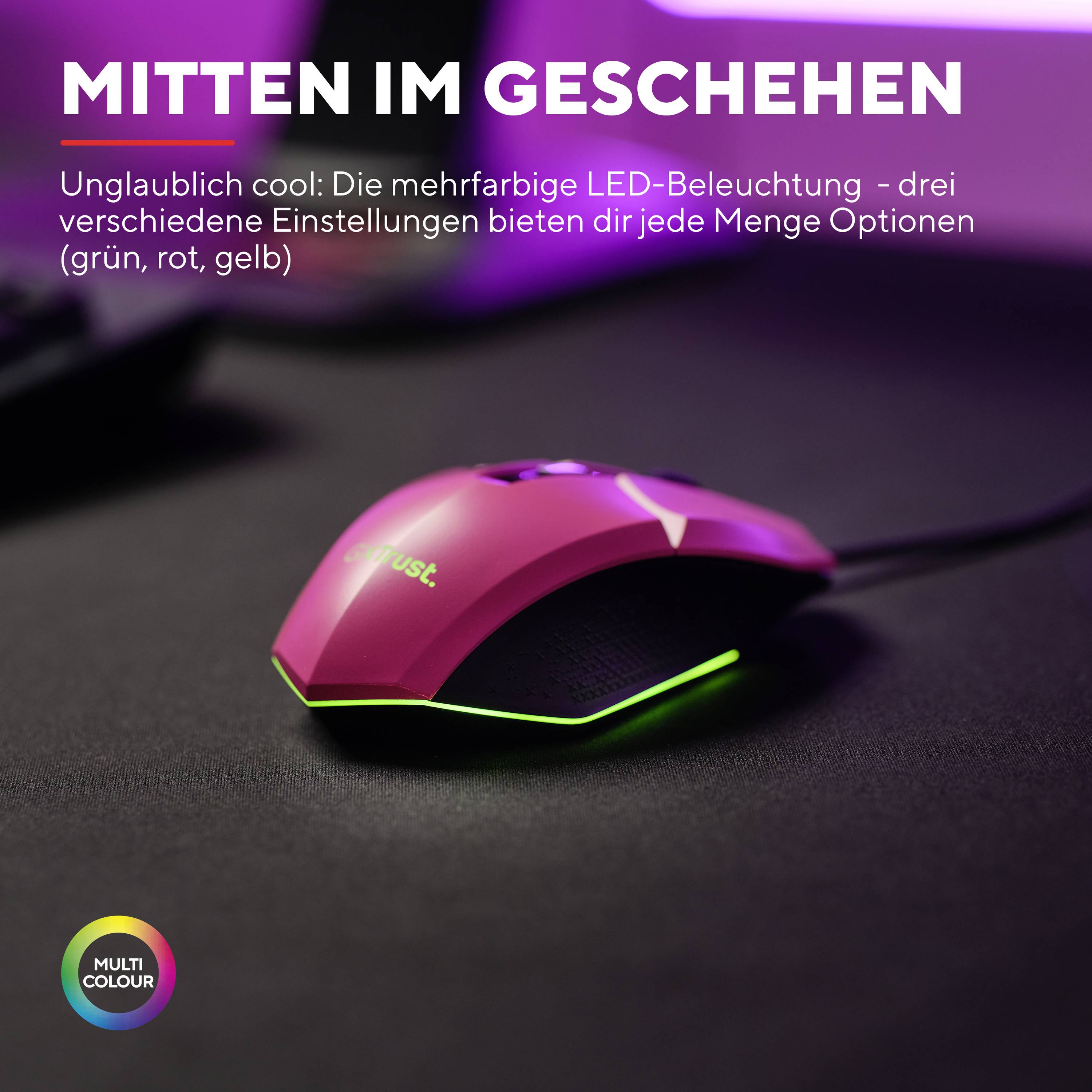 Une souris d'ordinateur rose avec un éclairage LED multicolore, accompagnée du texte : 'Au cœur de l'action'.
