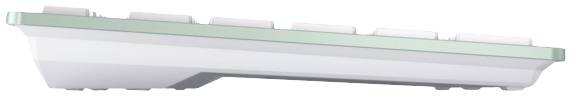 Un clavier d'ordinateur blanc, pris de côté. Les touches plates et rectangulaires sont montées sur un cadre fin de couleur verte.