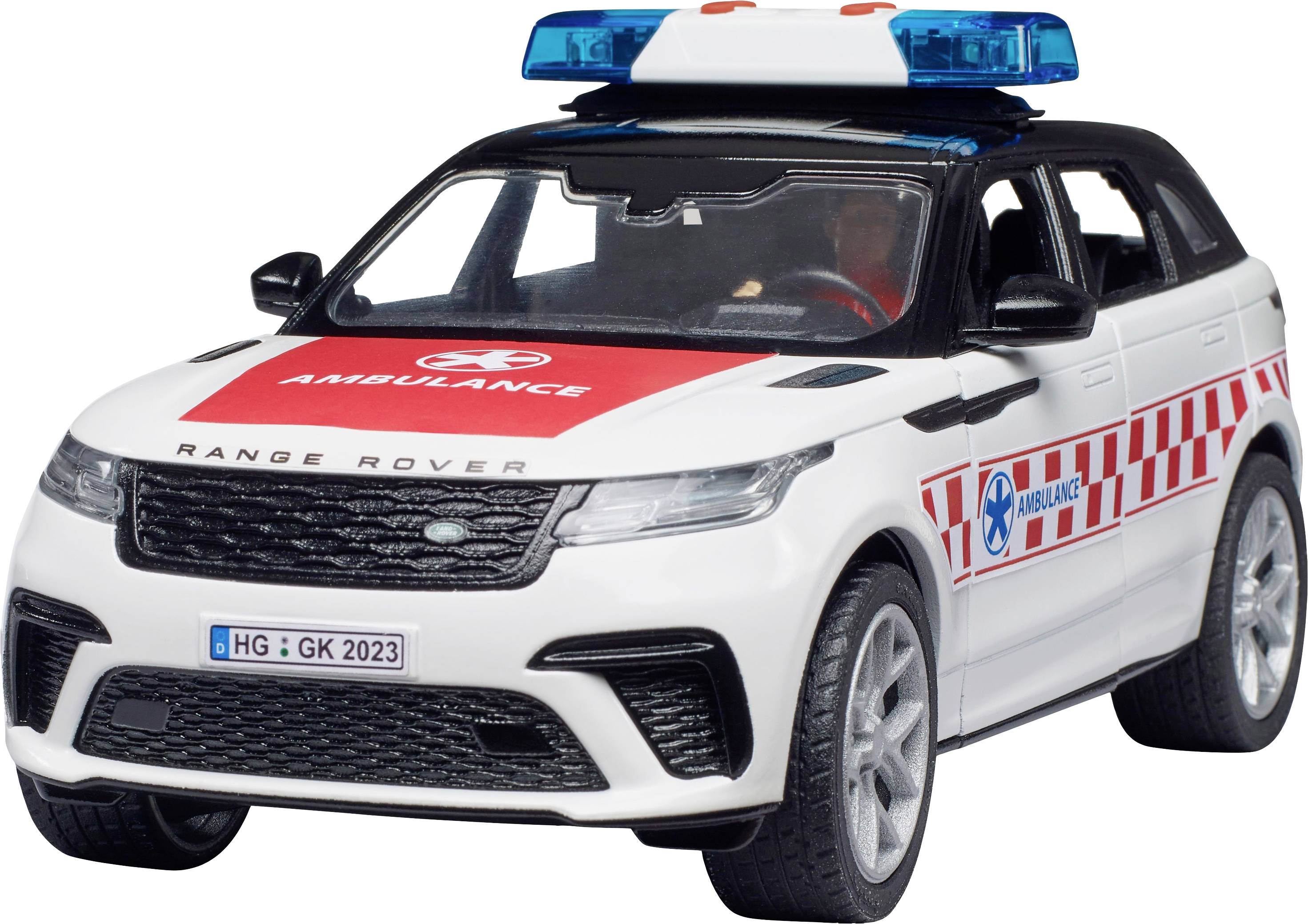 Une voiture de jouet blanche avec des bandes rouges et une barre lumineuse bleue sur le toit, portant l'inscription 'Ambulance'.