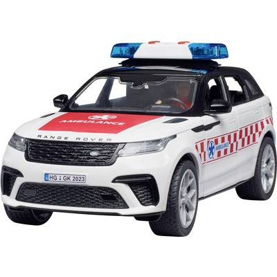 Une voiture de jouet blanche avec des bandes rouges et une barre lumineuse bleue sur le toit, portant l'inscription 'Ambulance'.