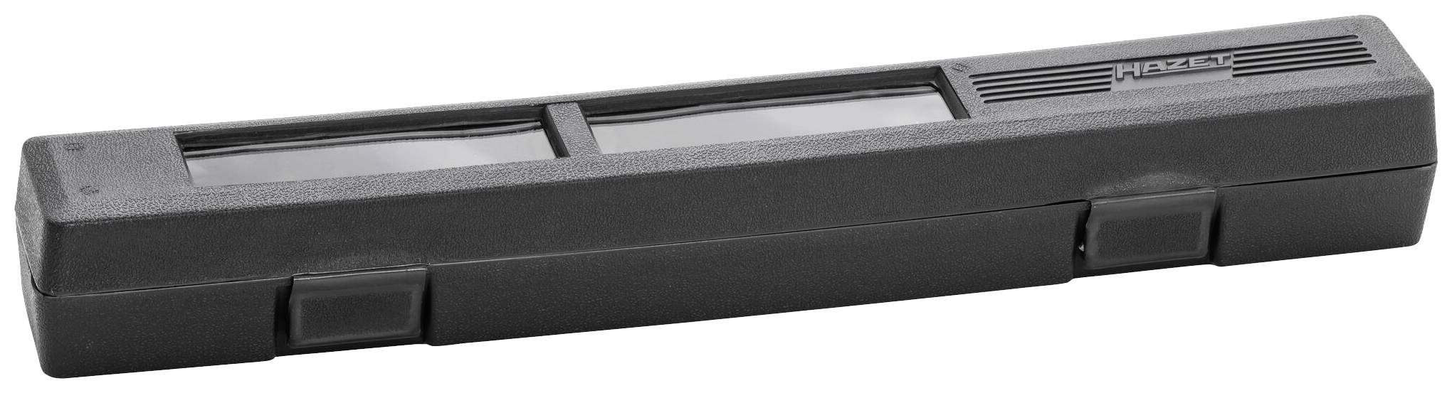 Un boîtier rectangulaire noir avec deux lentilles en haut. Dimensions de positionnement du produit. Corps principal en plastique.