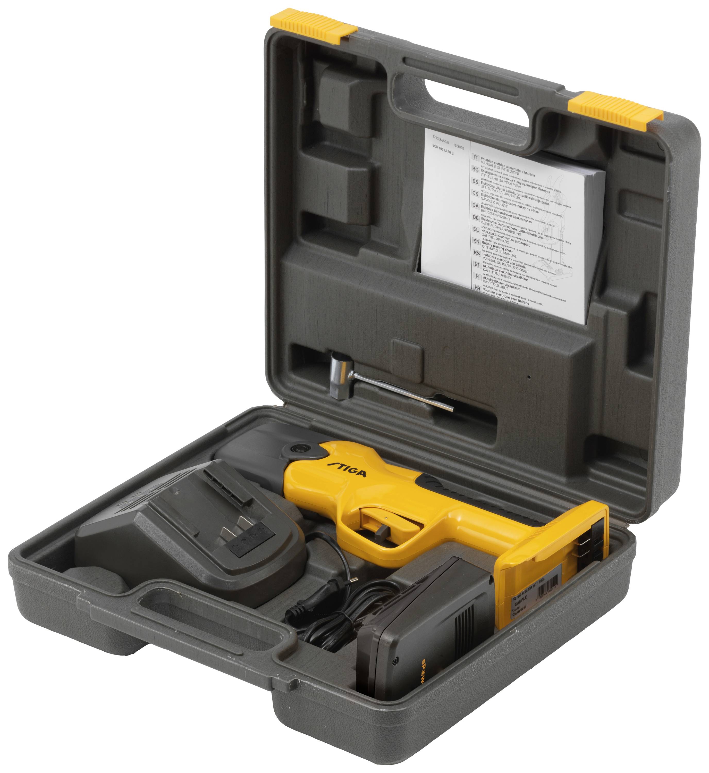 Un ensemble d'outils électriques orange dans un coffret gris ouvert. Comprend un chargeur, une batterie et un mode d'emploi. Principalement destiné aux travaux de bricolage.