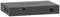 Un commutateur réseau noir portant l'inscription 'NETGEAR', avec des connexions de câbles et des fentes de ventilation, placé sur une surface plane.