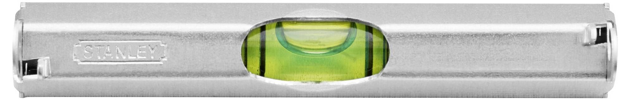 Niveau à bulle en étui argenté avec une bulle jaune au centre, indiquant un alignement horizontal précis.