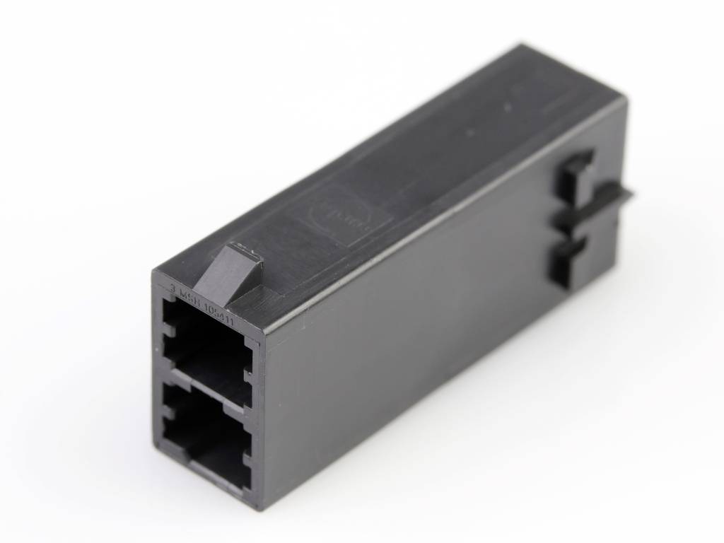 Adaptateur en plastique noir avec deux connexions réseau ; permet de connecter des câbles Ethernet.