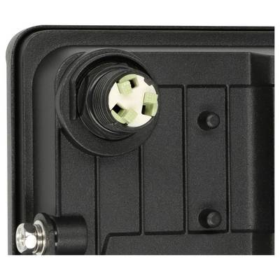 Gros plan d'un boîtier de dispositif noir avec un connecteur circulaire à socket et trois broches vertes à l'intérieur, plus une fixation métallique en bas à gauche.