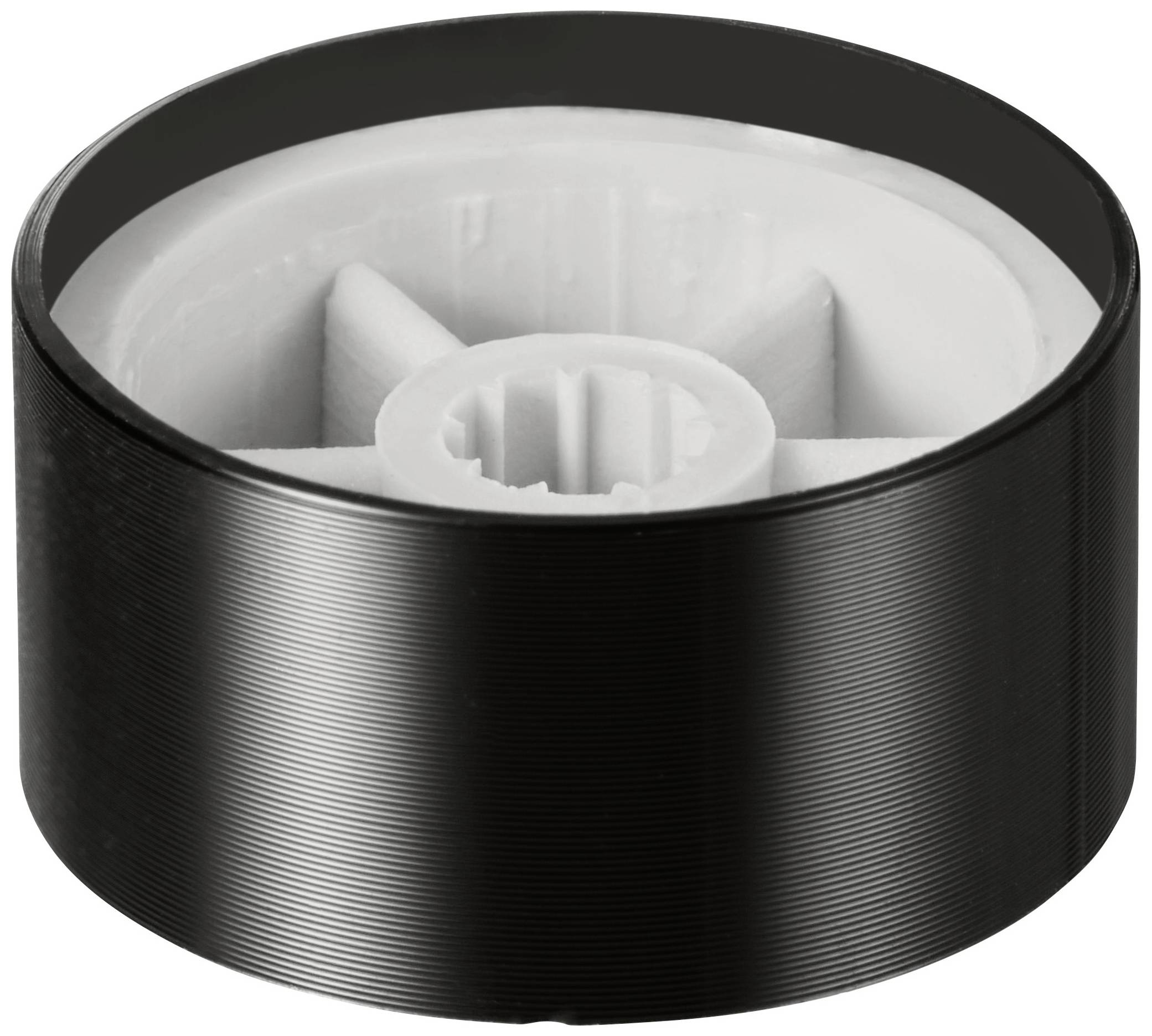 Une pièce cylindrique en plastique noir et blanc, probablement une pièce de rechange ou un élément mécanique avec un engrenage central.