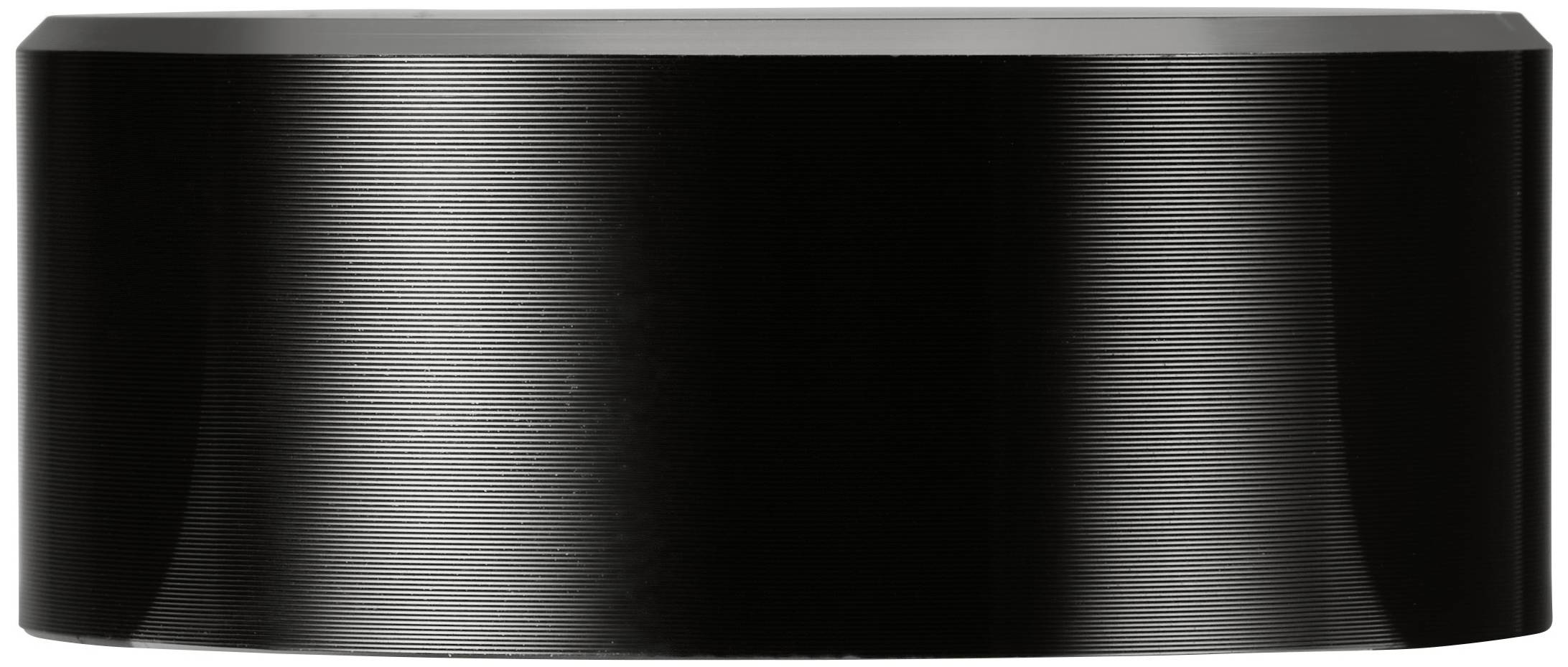 Haut-parleur noir, cylindrique, à surface lisse et avec un léger reflet lumineux ; ne présentant aucun logo ni élément de commande.