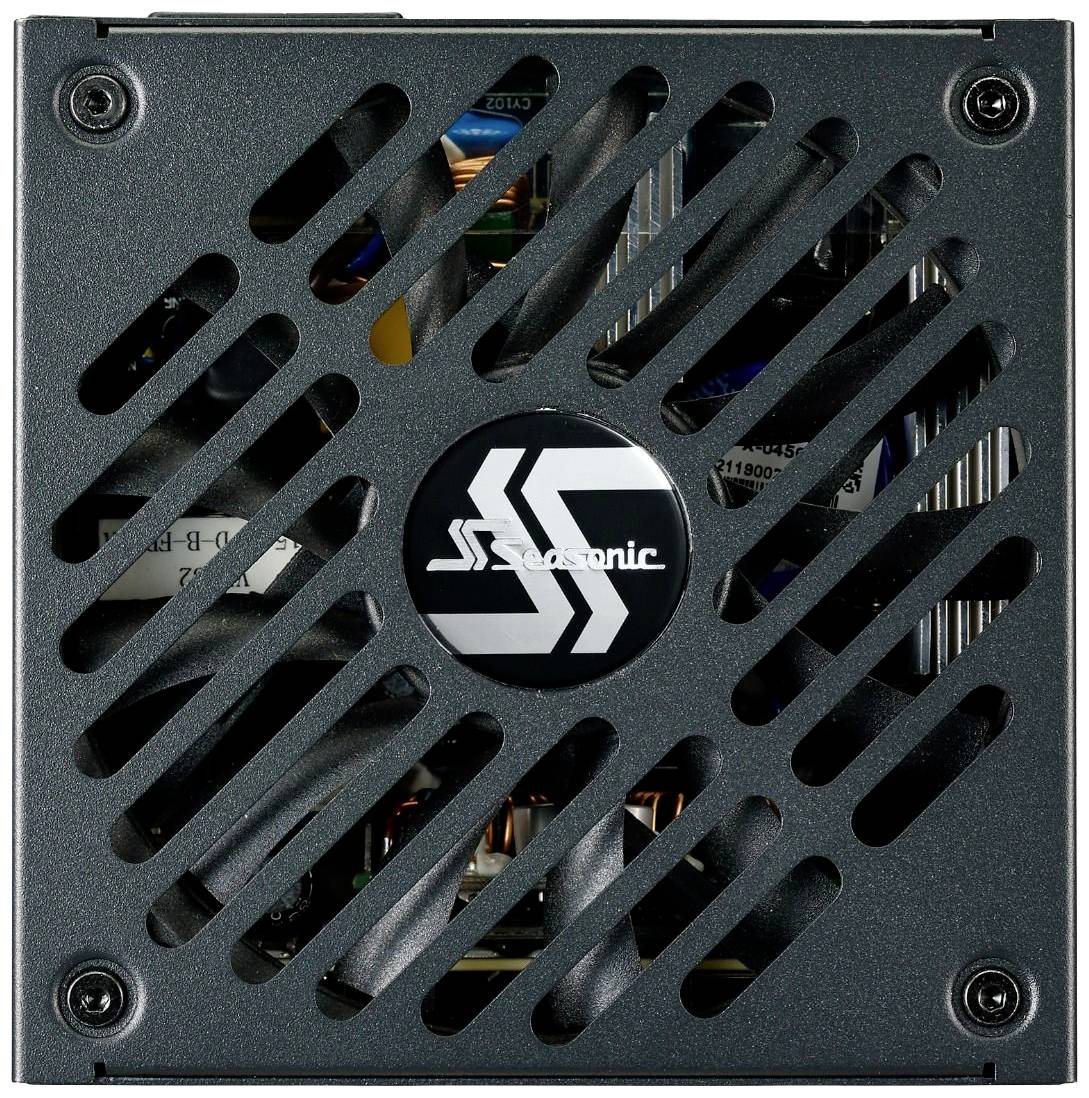 Bloc d'alimentation de Seasonic avec une grille de ventilateur et un logo au centre.