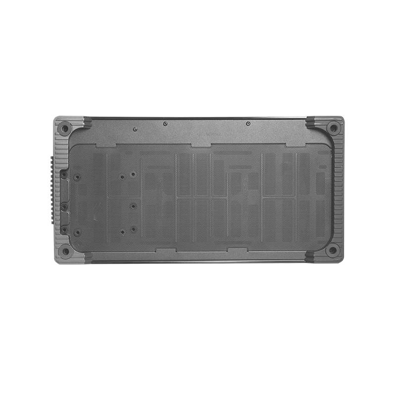 Dispositif électronique noir et rectangulaire dans un boîtier de protection, probablement une batterie ou un module technique.