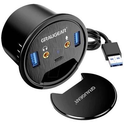 Champ de connexion rond de table avec nom de marque, deux ports USB, ports HDMI et audio, avec un couvercle amovible à côté.