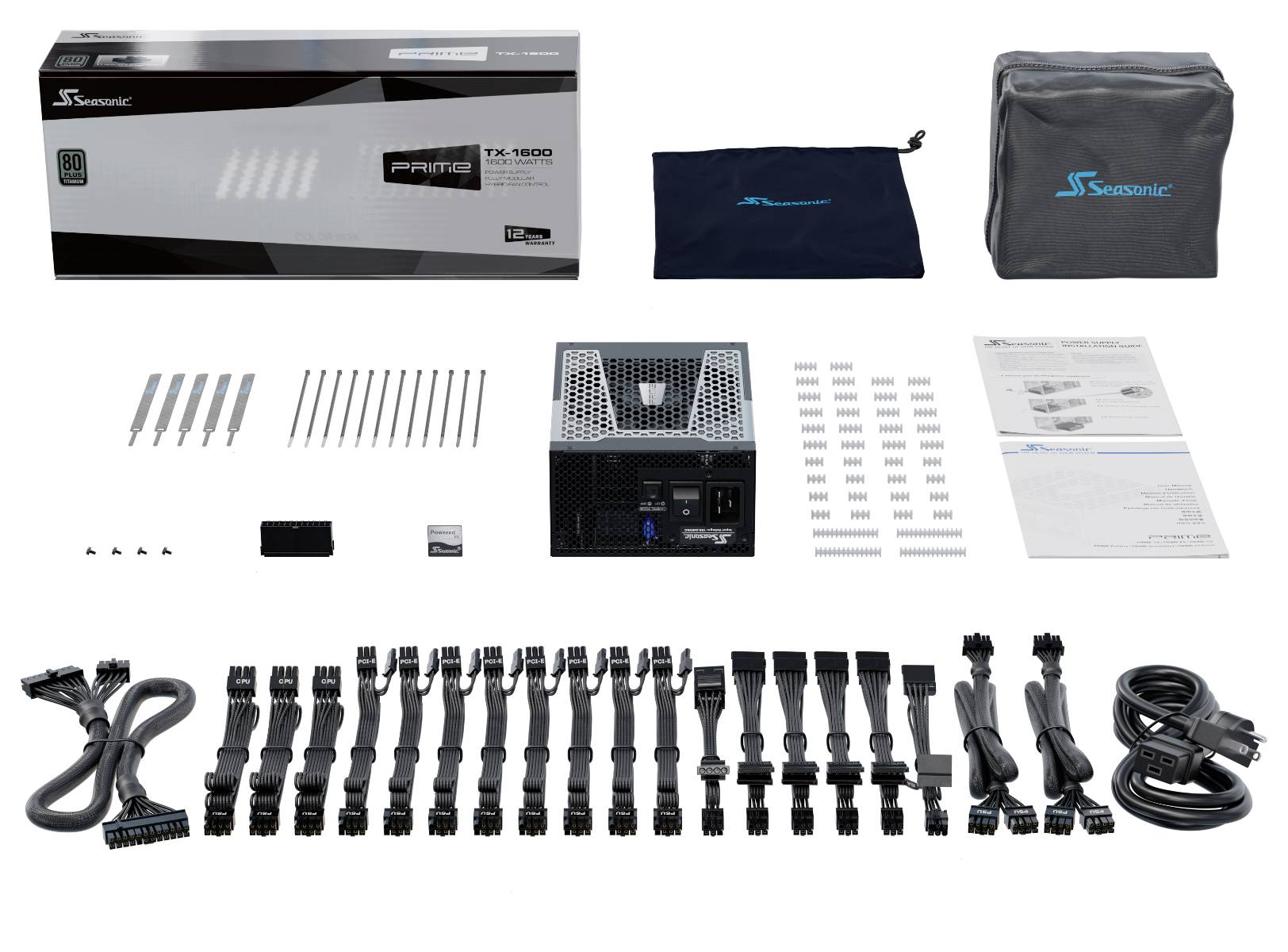 Alimentation électrique avec accessoires : câbles, vis, attaches-câbles et instructions. Le tout étalé devant un carton et un sac en tissu.