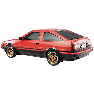 Voiture miniature rouge d'un coupé sport classique avec des détails noirs et des jantes dorées, vue latérale arrière.