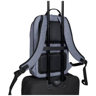 Un sac à dos gris avec un cadre métallique rigide posé sur une valise noire. Le sac à dos est équipé de bretelles rembourrées.