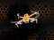 Un drone orange à quatre hélices rotatives vole de face, entouré d'un fond sombre avec un motif en nid d'abeille.