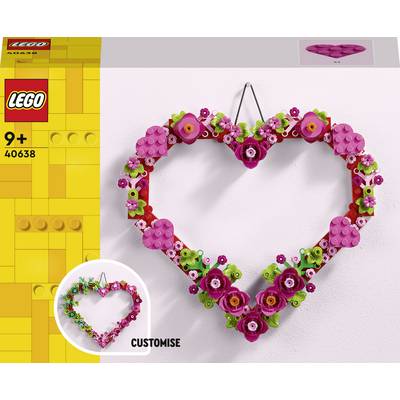 Une couronne en forme de cœur composée de briques LEGO, ornée de fleurs roses et mauves, adaptée aux enfants à partir de 9 ans.