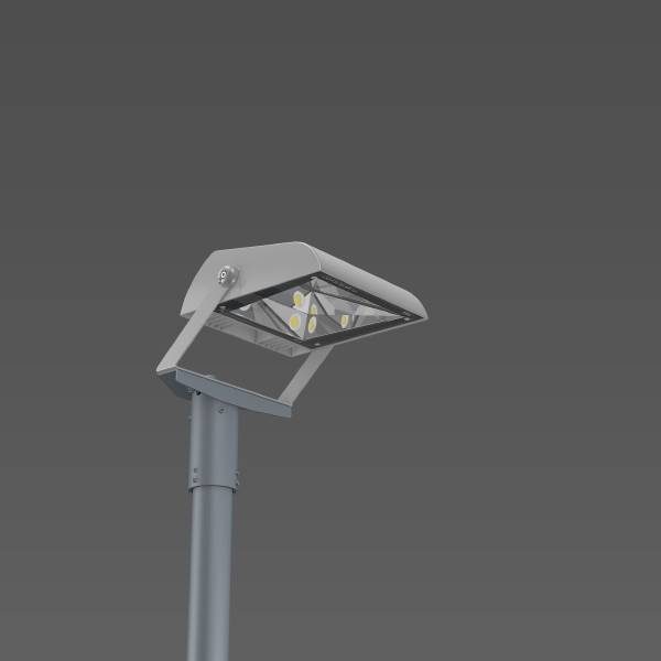 Un lampadaire moderne avec des lumières LED sur un mât métallique devant un fond gris.
