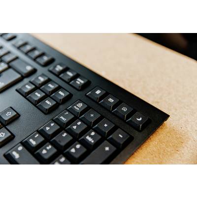 Un clavier d'ordinateur mettant l'accent sur des touches spéciales comme 'E-mail' et 'Mode veille'. Les touches sont noires avec des symboles blancs sur une surface claire.