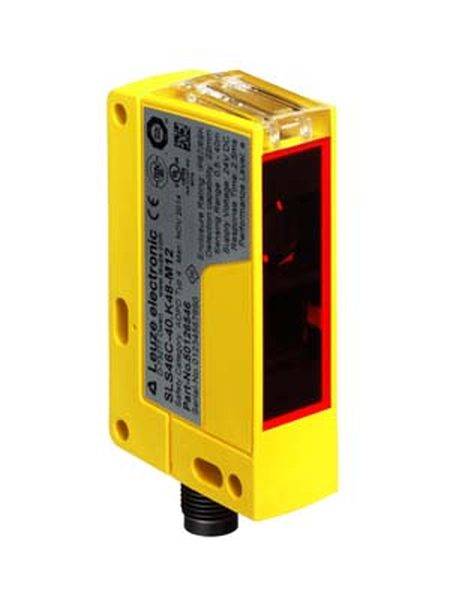 Capteur optique jaune avec connecteur noir sur la face inférieure et une étiquette de spécifications sur le côté.