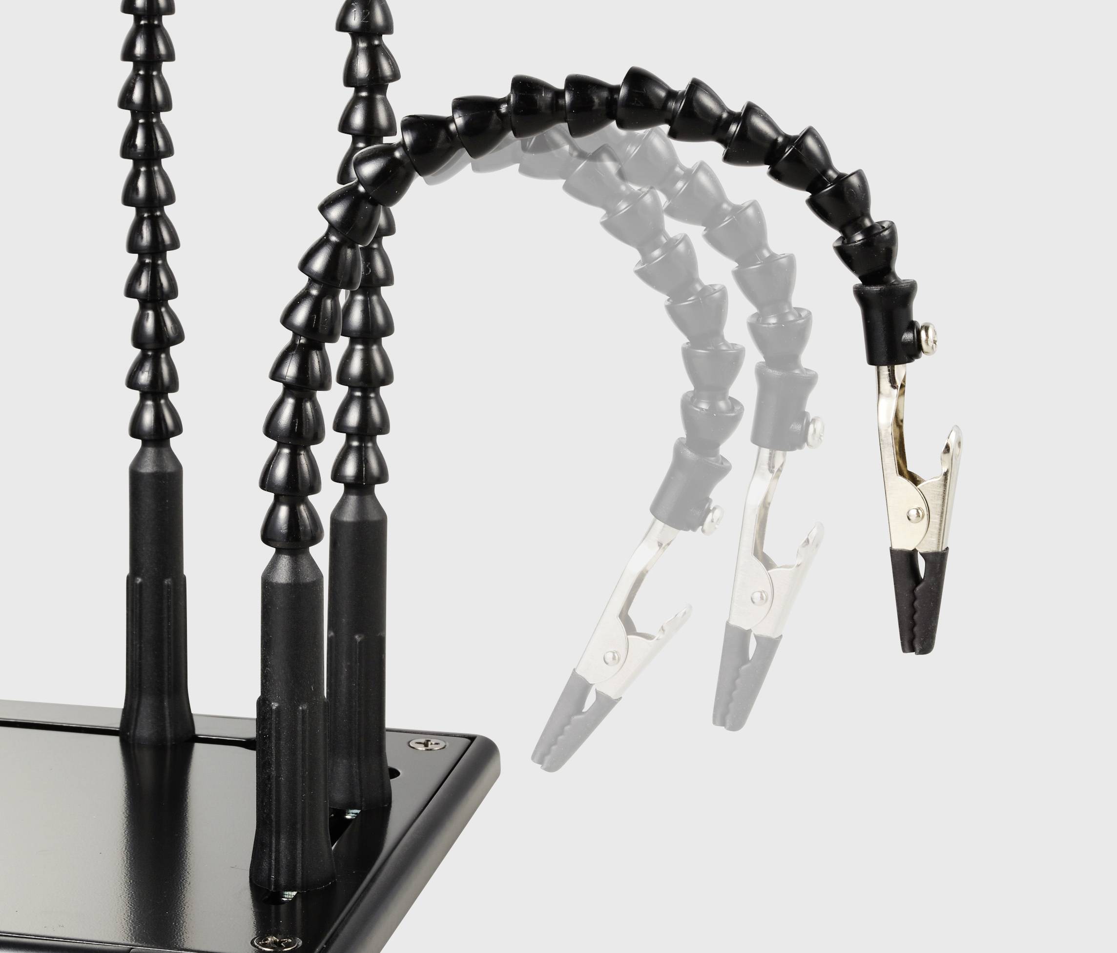 Deux bras de préhension flexibles munis de pinces crocodile fixés sur un support stable, adaptés pour maintenir en toute sécurité de petits objets lors de travaux.