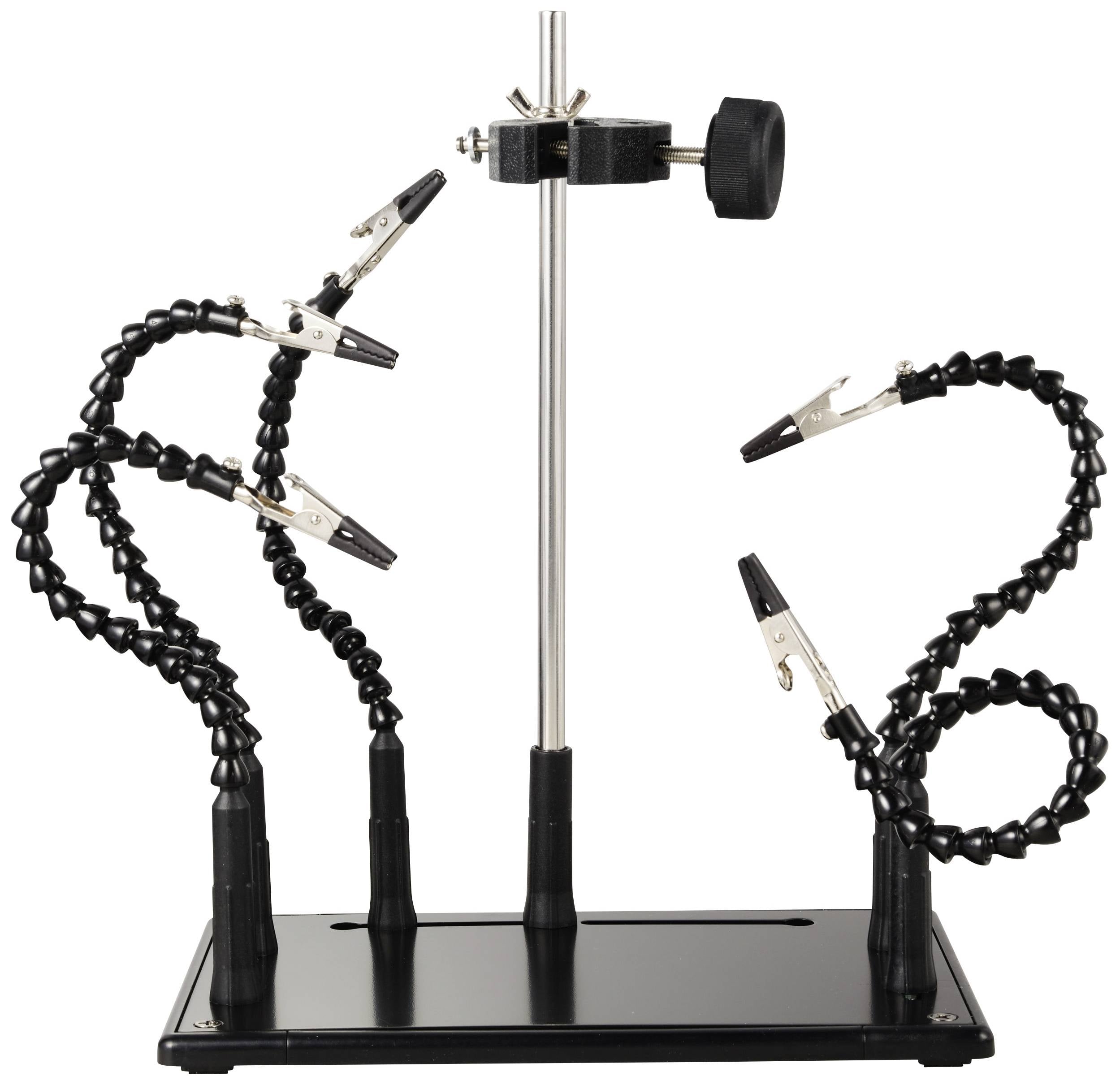 Aide au soudage avec quatre pinces crocodiles flexibles fixées sur un socle stable. Utilisable pour assister les travaux de soudure.