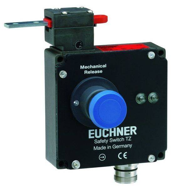 Un bouton d'arrêt d'urgence avec touche bleue et 'Déverrouillage mécanique'. Inscription : 'EUCHNER Safety Switch TZ Fabriqué en Allemagne'.