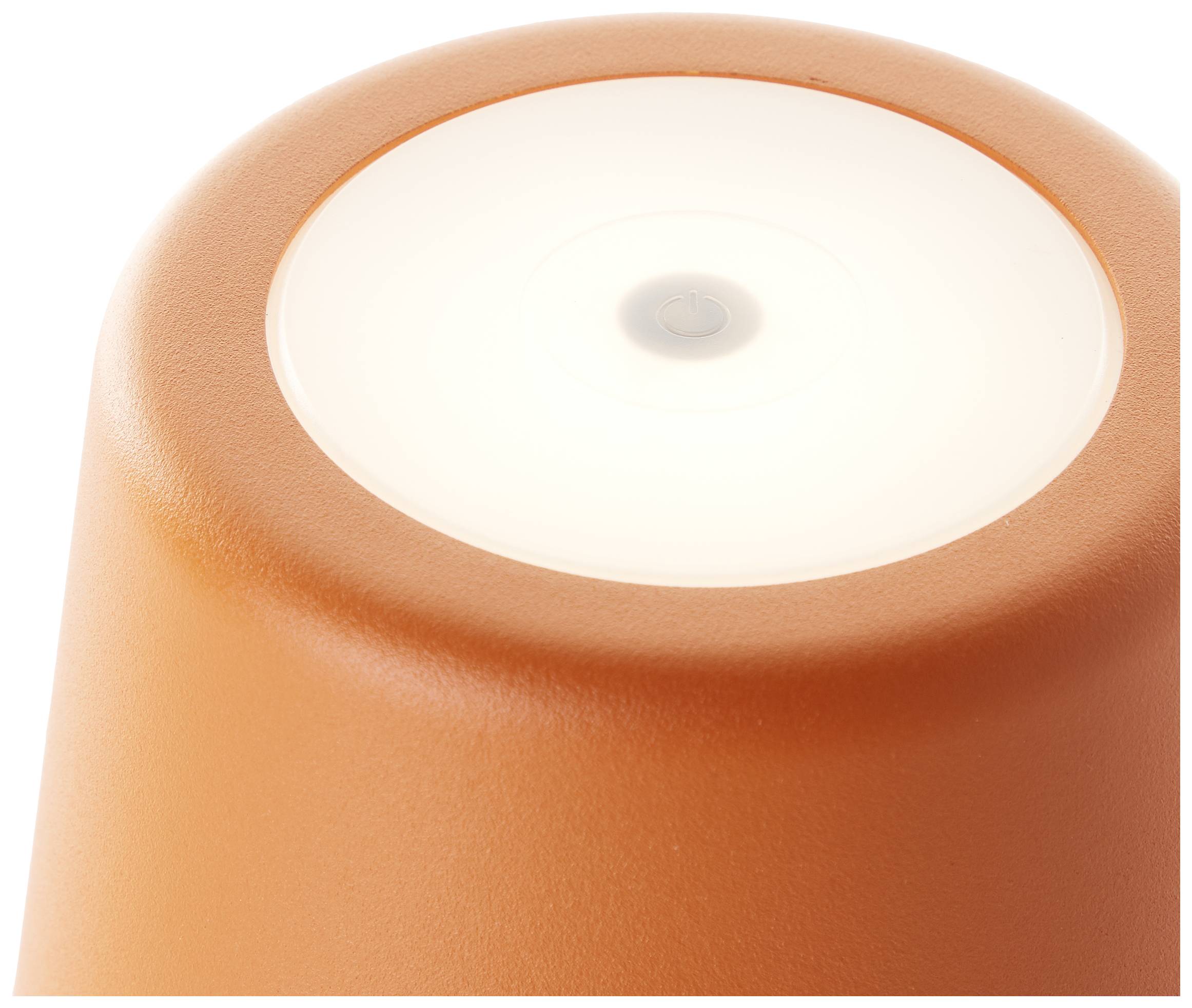 Lampe de table orange au design minimaliste, avec un champ lumineux circulaire sur le dessus.