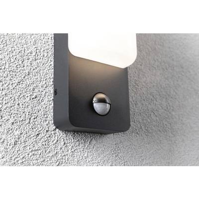 Lampe extérieure avec capteur de mouvement intégré sur un mur gris.