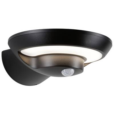 Applique extérieure ronde noire avec détecteur de mouvement intégré, fixée sur un mur. Elle émet une lumière douce et blanche.