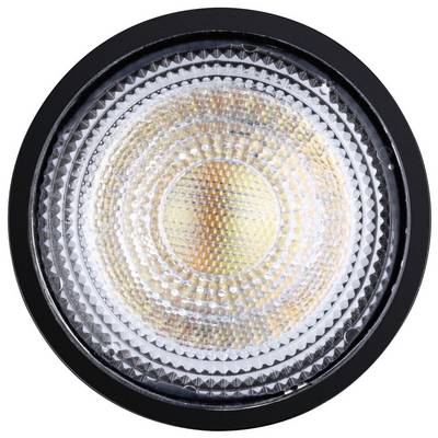 Gros plan d'une ampoule LED avec un motif circulaire sur la lentille. L'ampoule brille dans des tons de jaune et d'orange chaleureux.