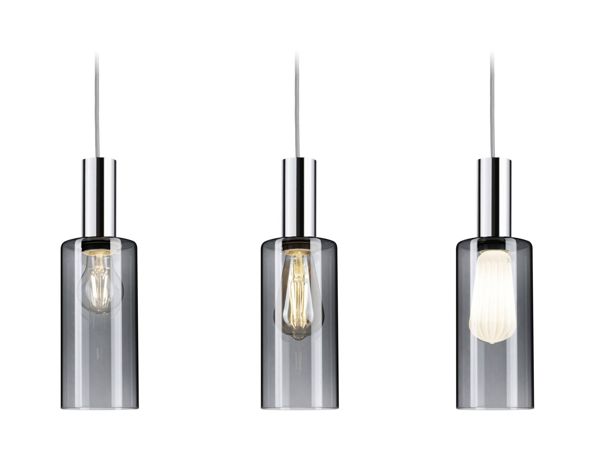 Trois lampes suspendues cylindriques en verre transparent, avec des ampoules visibles émettant différentes intensités lumineuses.