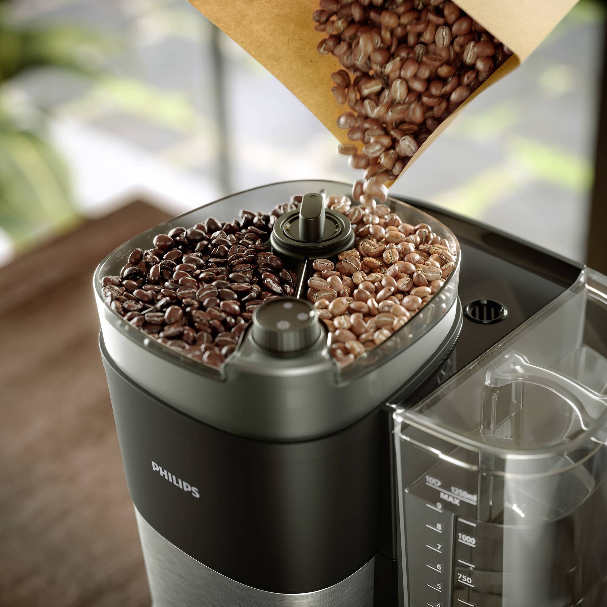 Un machine à café automatique avec un réservoir à grains intégré, rempli à moitié de grains de café clairs et à moitié de grains de café foncés.