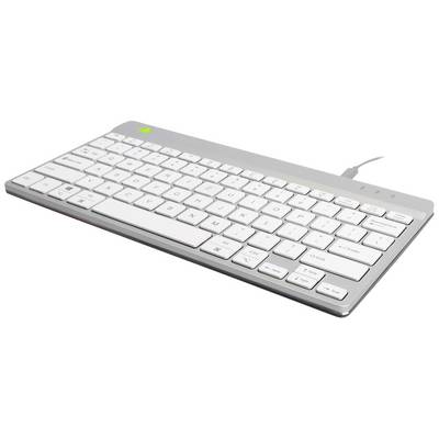 Un clavier d'ordinateur plat et argenté avec des touches blanches et une connexion filaire, photographié en plongée oblique.