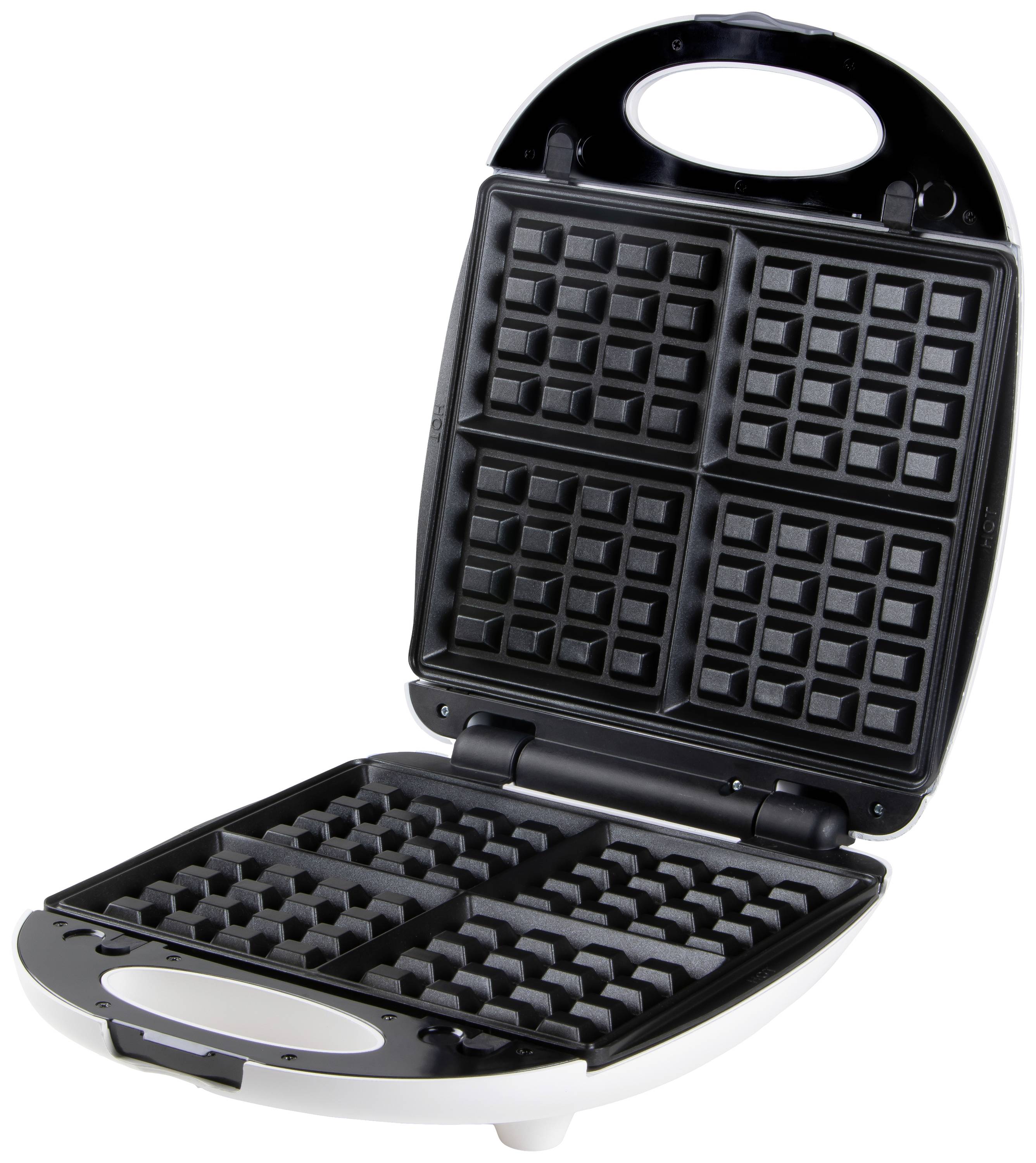 Gaufrier ouvert avec quatre moules rectangulaires, prêt à être garni.