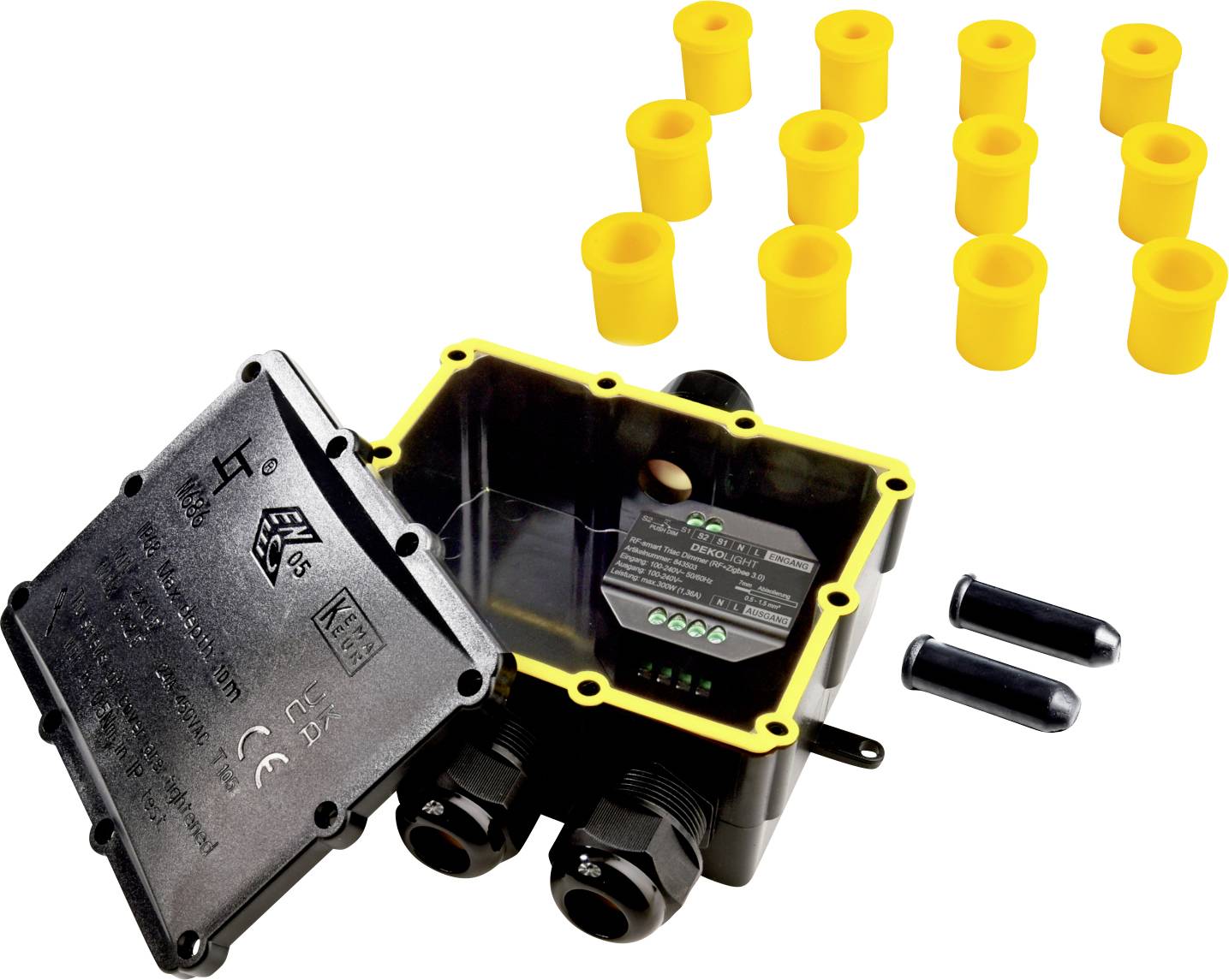Boîte de raccordement noire avec couvercle ouvert, montrant le câblage intérieur. Presse-étoupes jaunes et deux presse-étoupes noirs à côté.