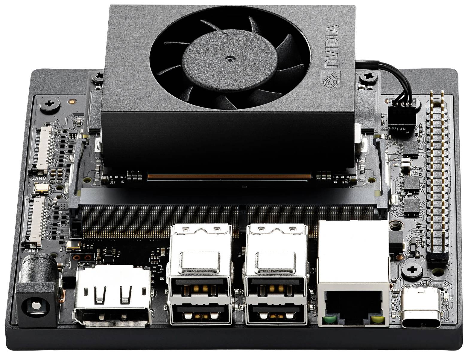 Un ordinateur monocarte avec plusieurs ports USB, un port Ethernet et un dissipateur thermique équipé d'un ventilateur.