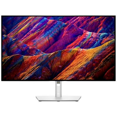 Un écran affiche une image colorée de montagnes dans des tons de rouge et de bleu. Les couleurs vives mettent en valeur les différentes couches de montagnes.